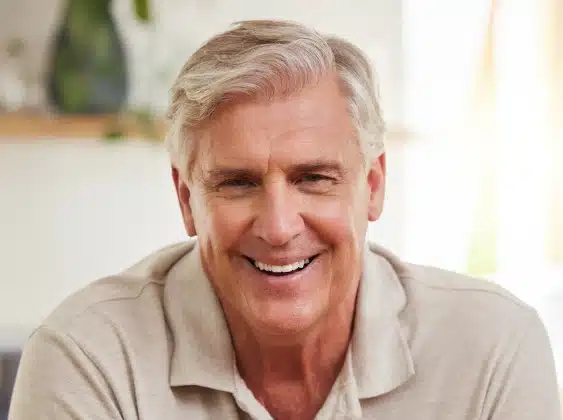 Smiling older man with a confident smile after secure denture treatment — Dental Care of Mid Florida, Sebring, FL.